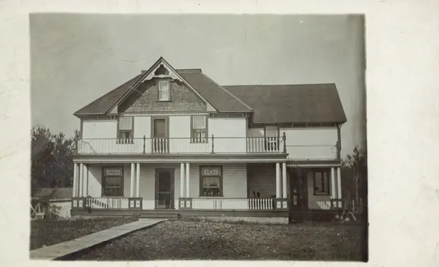 Two-storey house with porch and balcony